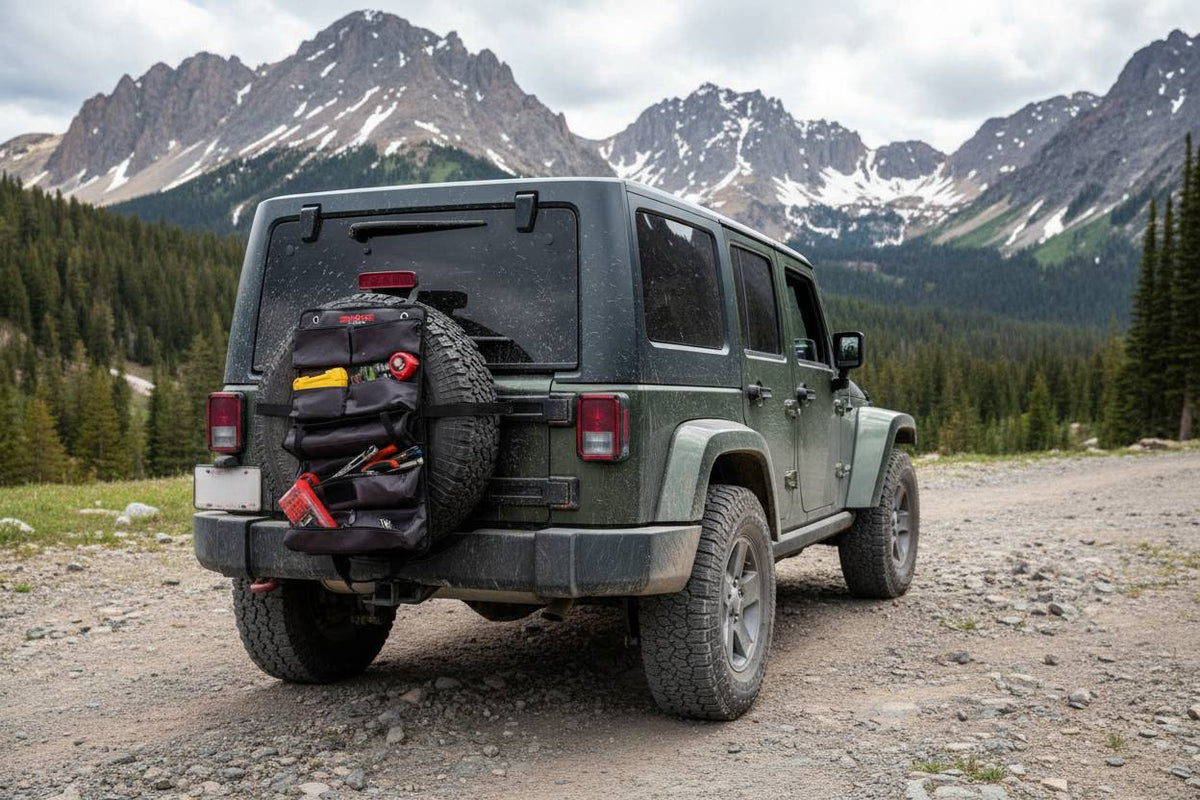 Jeep Wrangler on a dirt road with mountains in the background